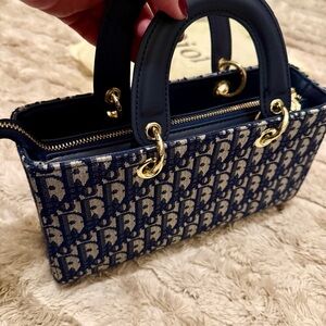 CD embroidered navy blue handbag